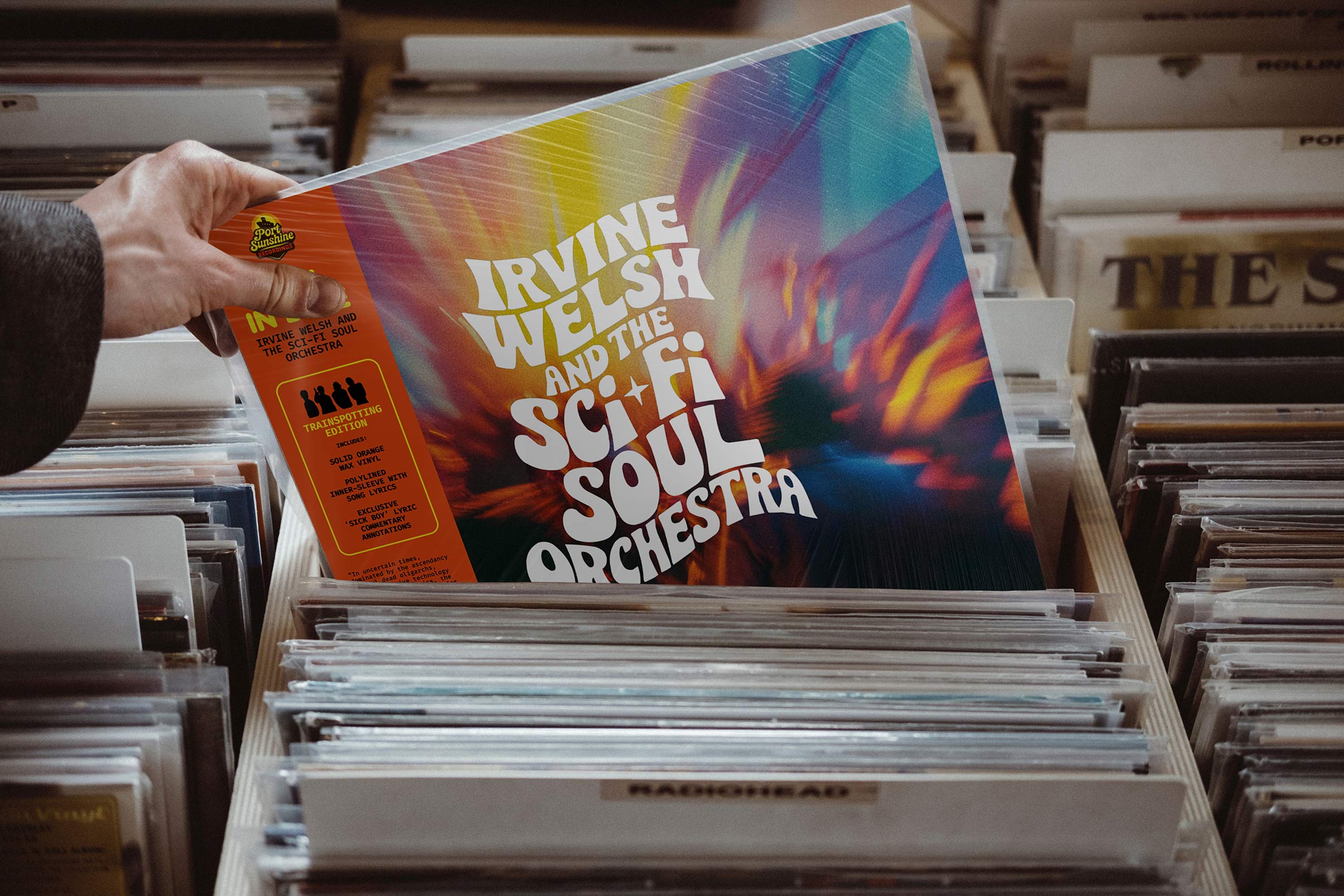 Irvine Welsh & The Sci‑Fi Soul Orchestra — Men in Love vinyl in a record store crate